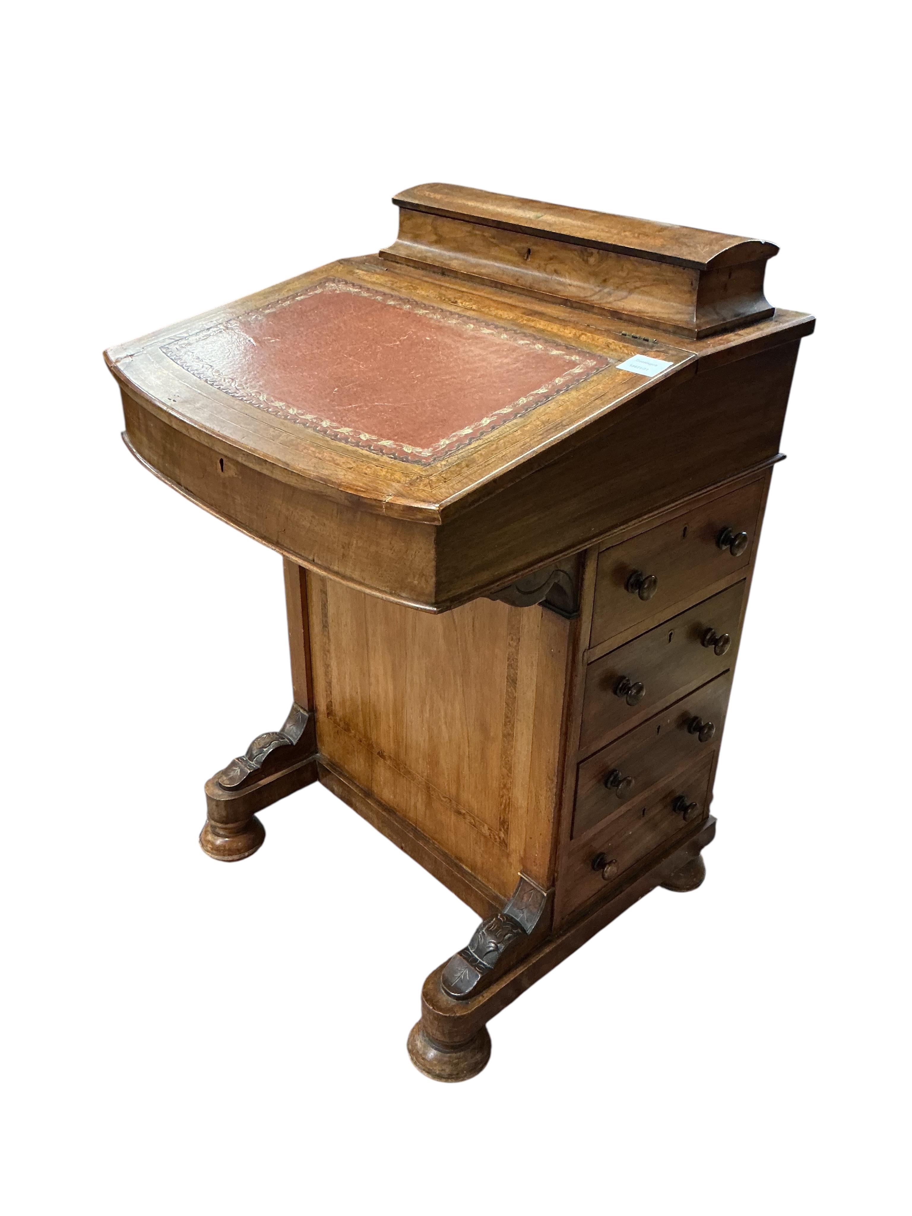 A late Victorian banded walnut Davenport, width 53cm, depth 54cm, height 84cm